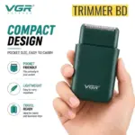 VGR-V-390-compact-hair-shaver-held-in-hand-showing-its-portable-design